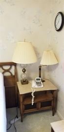 Pair of stone topped side tables and glass bubble lamps