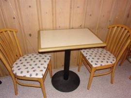 Vintage bar table and two chairs with KU upholstery. There are two sets.