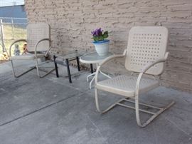 Vintage metal patio chairs and 2 glass top side tables.