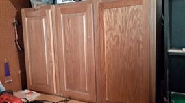 Three oak cabinets in like-new condition.
