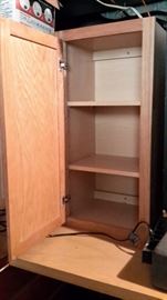 Three oak cabinets in like-new condition.
