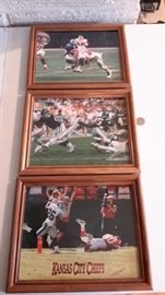 Three framed KC Chiefs photos.