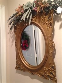 Oval mirror in an antique style frame