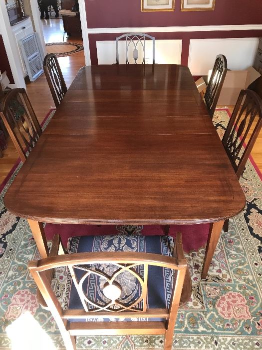 Cherry dining room table with leaves and six matching chairs