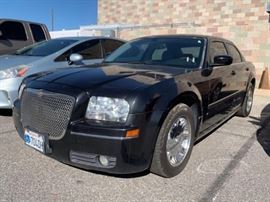 #58: 2006 Chrysler 300
Estimated DMV Registration: $257 and $70 doc fees 

Year: 2006
Make: Chrysler
Model: 300
Vehicle Type: Passenger Car
Mileage:
Plate: 
Body Type: 4 Door Sedan
Trim Level: Touring
Drive Line: RWD
Engine Type: V6, 3.5L; SOHC 24V
Fuel Type: Gasoline
Horsepower:
Transmission:
VIN #: 2C3LA53GX6H208623
 