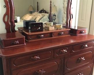 Vintage Lillian Russell solid cherry bedroom by Davis Cabinet Co. Set includes dresser with mirror, double glove box (removable), 2 single glove boxes (removable), two 3-drawer night stands and full-size poster bed. Set is priced individually and as a set. 