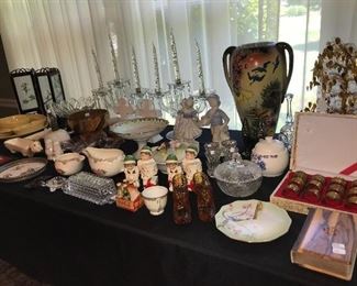 Tables full of decor, glassware, china, pottery and metal ware.