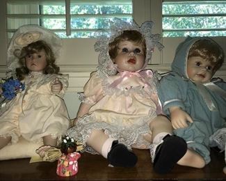 Oh, my goodness! Big collection of contemporary porcelain dolls and some vintage dolls--smoke free, pet free home. 