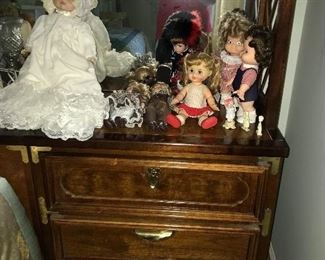 Oh, my goodness! Big collection of contemporary porcelain dolls and some vintage dolls--smoke free, pet free home. Shown with vintage bedroom furniture--bed with lighted bookcase headboard. Two end pieces come apart for use elsewhere.