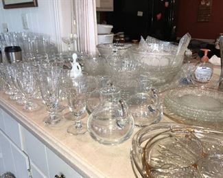 Tables and counters packed full of vintage glassware, hammered aluminum and more.