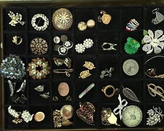 Big table full of vintage costume jewelry, 100s of pieces--rhinestones, necklaces, earrings (clip on and pierced), bracelets, lots of watches, pendants. Much more than what's pictured.