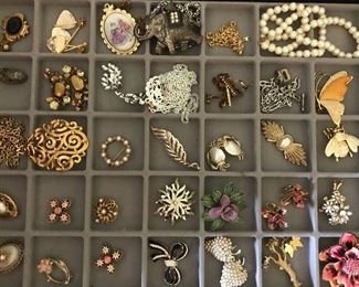 Big table full of vintage costume jewelry, 100s of pieces--rhinestones, necklaces, earrings (clip on and pierced), bracelets, lots of watches, pendants. Much more than what's pictured.