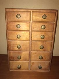 neat vintage cabinet with lots of drawers