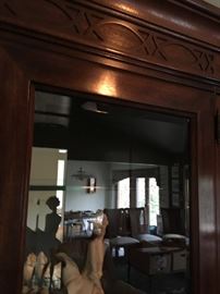 Accented-designed crown molding and beveled glass are only a few mentionables of the wall unit.