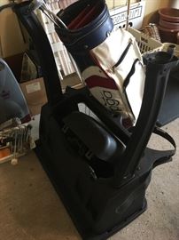 Golf bag holder for the back of golf cart.