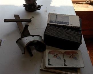 Antique stereoscope with lots of cards