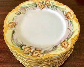 Hand painted Limoges plates, each with a different flower