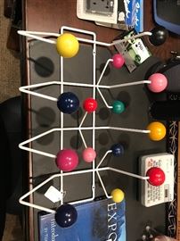 Eames Hang it All Design Charles & Ray Eames, 1953
Steel rod frame, solid wood spheres
Made by Herman Miller