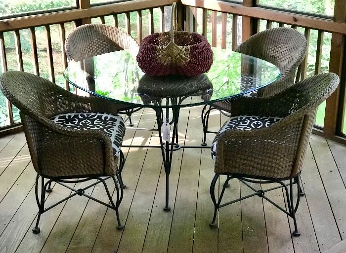 Lloyd Loom by Lloyd Flanders round wicker dining table and four chairs.