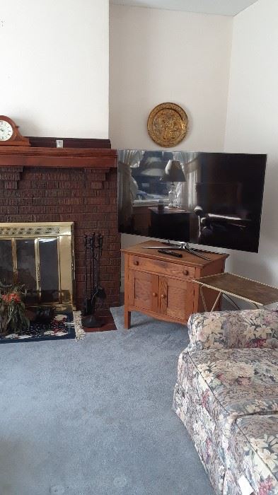 Flat screen tv on antique wash stand, sofa