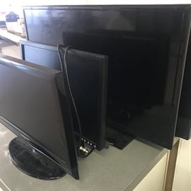 several monitors/TV screens