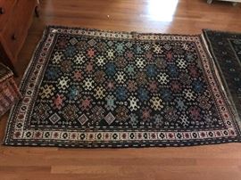 Measures 4’8” x 6’8”. 