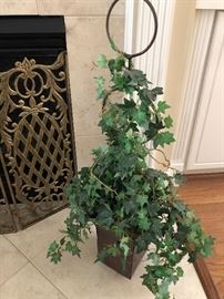 Topiary on the floor in front of the fireplace $36