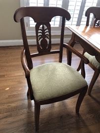 Super cute dining table with pineapple motif carved into the backs of each chair… $1100 for the Ethan Allen set...The fabric on the chairs even has a pineapple design