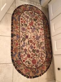 Floral loop rug $40...No other rugs in this house are for sale