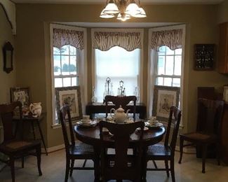 Antique Dining Room table with 2 leaves, Set of 6
cane antique chairs.