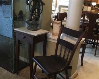 Small Marble top table, Bronze Ship Captain , Antique Plank Bottom Side Chair.