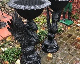 Pair of winged griffin metal urns