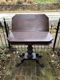 Period game table with hairy paw feet