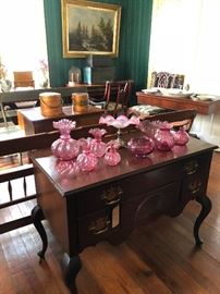 Pennsylvania House cherry low boy, Fenton cranberry art glass and lamp