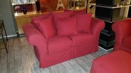 red cloth loveseat, 70" long.
