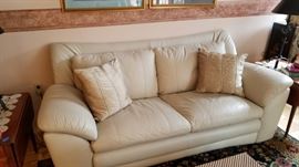 2 white leather sofas
