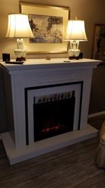 free-standing electric fireplace, with blower. 49" tall x 59" wide x 25" deep