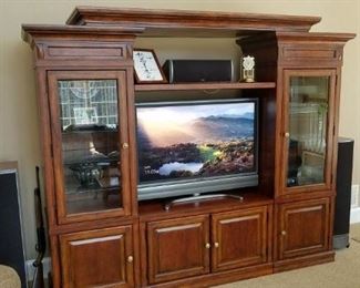 entertainment unit, 3 piece, can sell sides separately. Made by Mirador. Measures: 95" long x 80" tall x 21" deep.