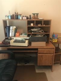 2nd desk with lots of desk items