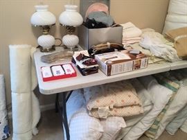 Bedroom has more linens and bed pillows