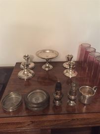Sterling silver salt and pepper shakers, coasters, and candlesticks