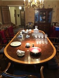 Nice large mahogany dining table with pattern of overall cracking to finish (or craquelure), but quite stable! top is 1 piece. There are 10 chairs which need strengthening at their leg joints.