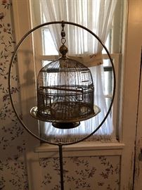 brass bird cage on stand