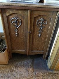 antique oak cabinet in attic