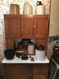 Hoosier cupboard in great condition/ antique crocks