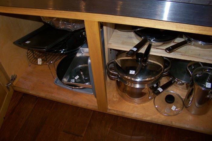 Kitchen is packed with cookware, appliances