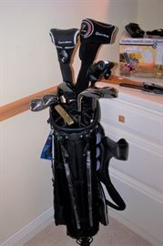 4 sets of golf clubs with nice bags