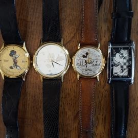 Four Mickey Mouse watches, including a 60th anniversary and a Hollywood Mickey watch