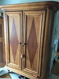 Tiger Maple is noted in this beautiful cabinet designed by Jim Peed. It measures 80x48x24”deep.