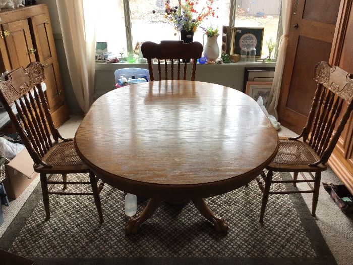 Oak Ding Table with claw feet and caned high back chairs